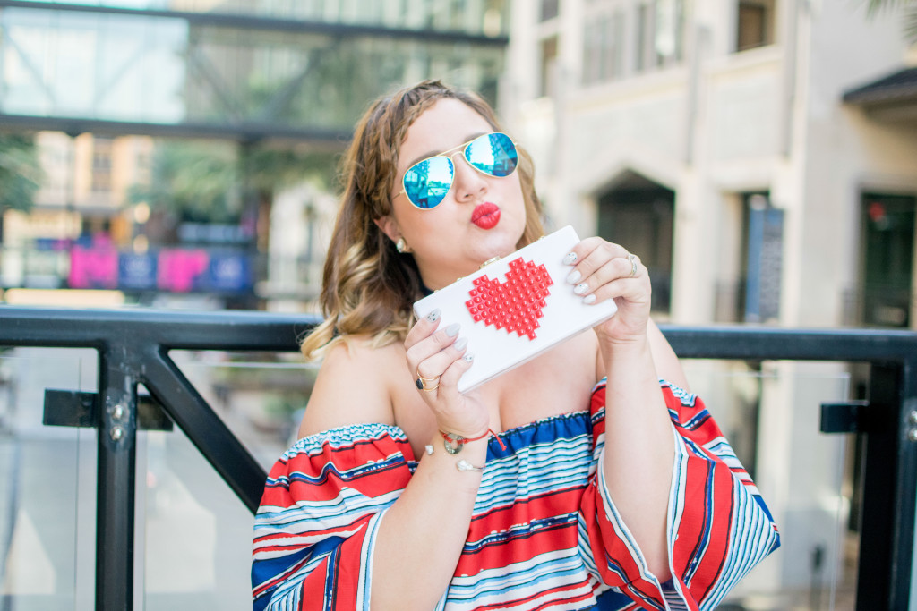 Red, white and blue outfit with darkn wash denim and red lips 